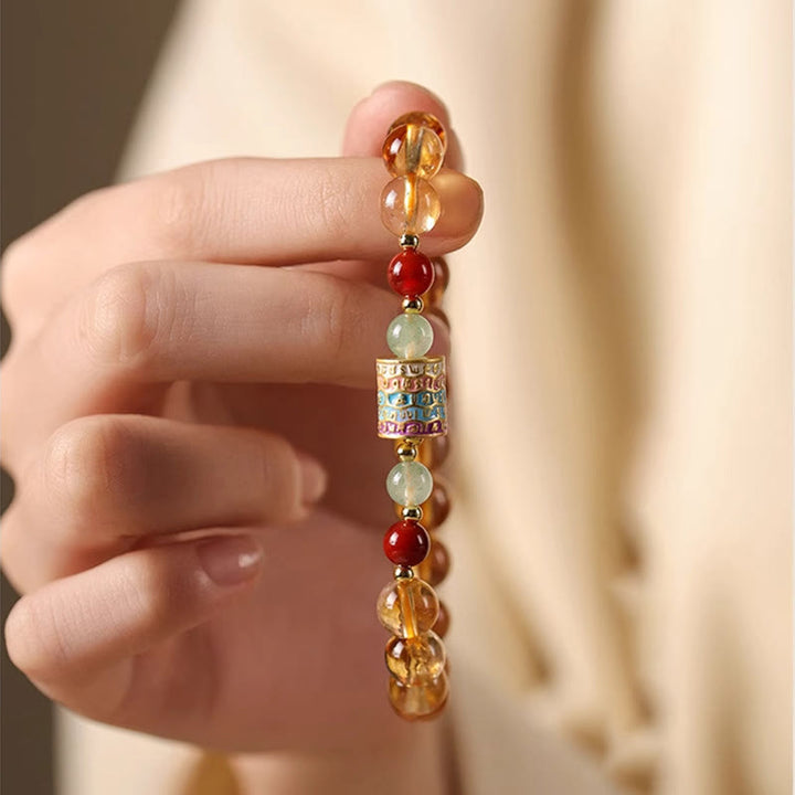 Braccialetto della creatività con ruota di preghiera colorata in citrino naturale Buddha Stones