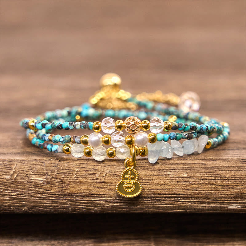 Braccialetto Buddha Stones con perline turchesi e triplo giro