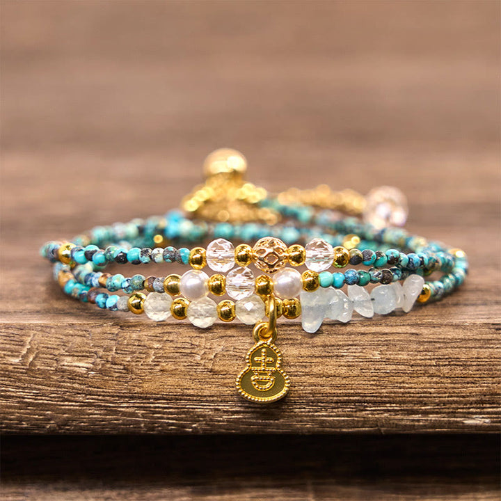 Braccialetto Buddha Stones con perline turchesi e triplo giro