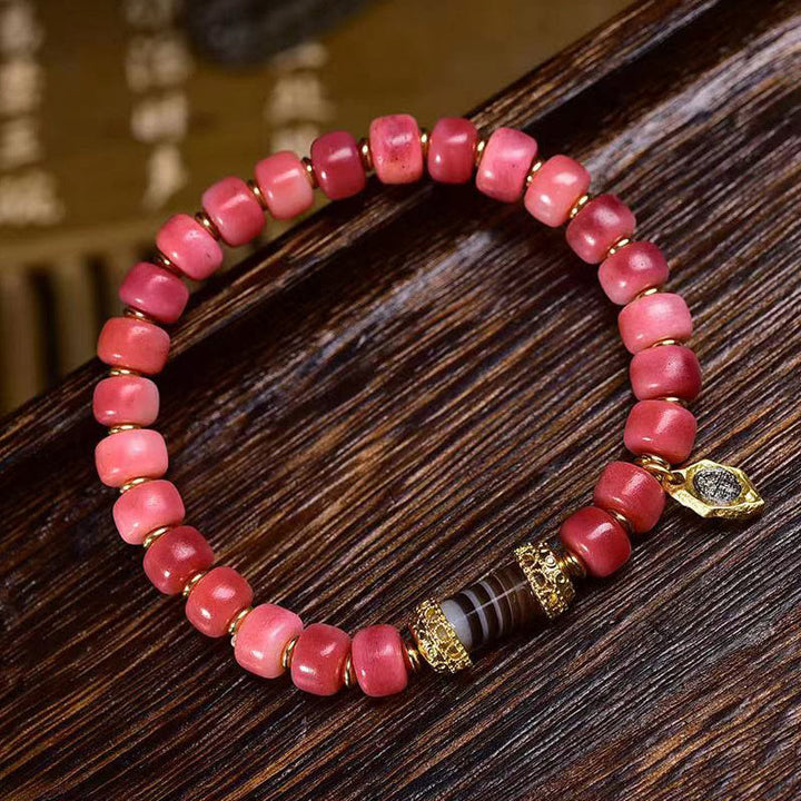 Braccialetto della fortuna in agata rossa e rame con osso di cammello tibetano Buddha Stones