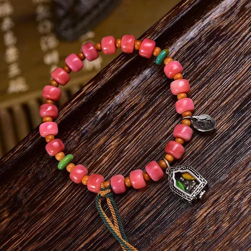 Braccialetto della fortuna in agata rossa e rame con osso di cammello tibetano Buddha Stones