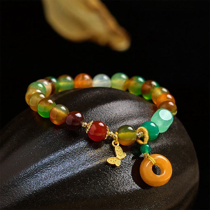Braccialetto di supporto con fibbia della pace a farfalla, mughetto, agata pavone colorata naturale di Buddha Stones