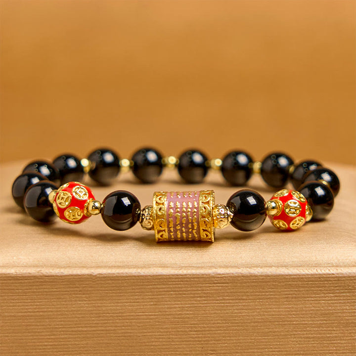 Bracciale della fortuna con cinque monete di rame e onice nero naturale di Buddha Stones