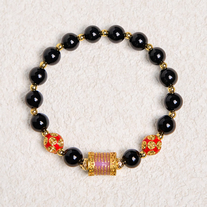Bracciale della fortuna con cinque monete di rame e onice nero naturale di Buddha Stones