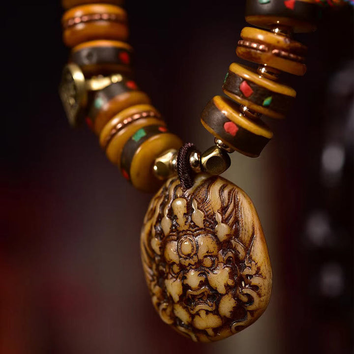 Braccialetto di protezione con nappa in osso di cammello tibetano Buddha Stones