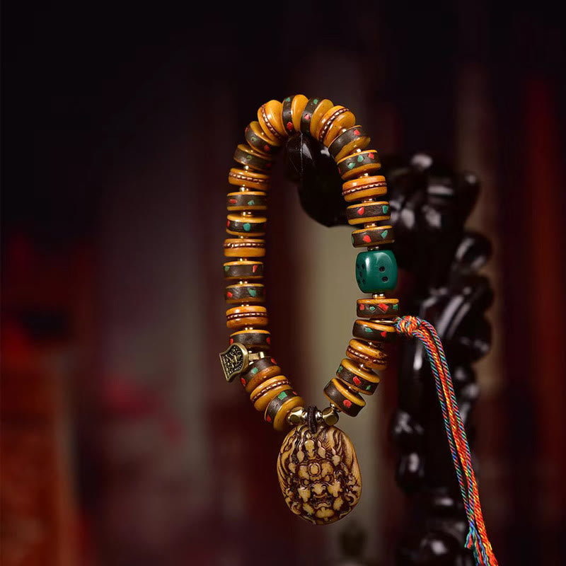 Braccialetto di protezione con nappa in osso di cammello tibetano Buddha Stones