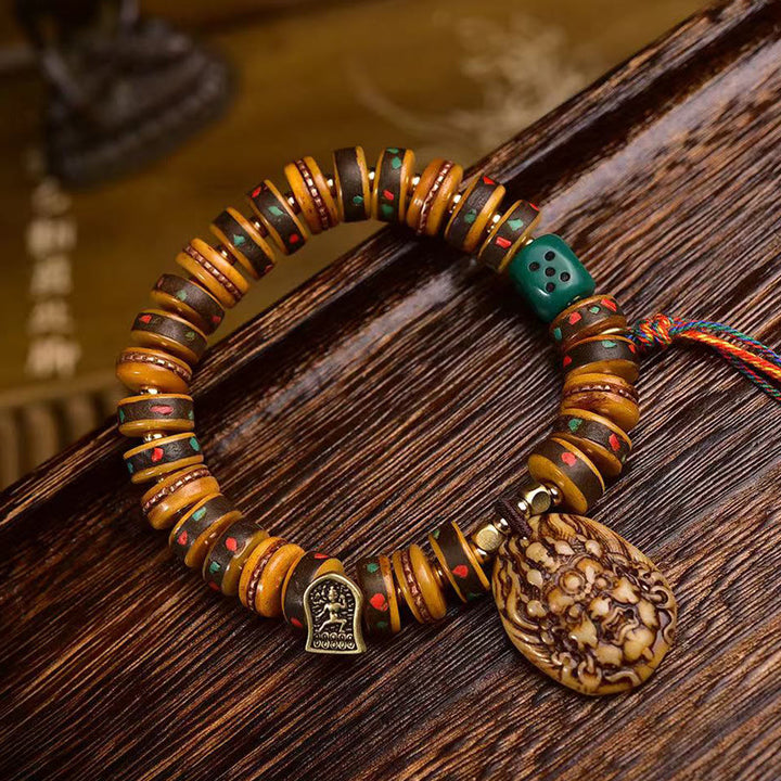Braccialetto di protezione con nappa in osso di cammello tibetano Buddha Stones