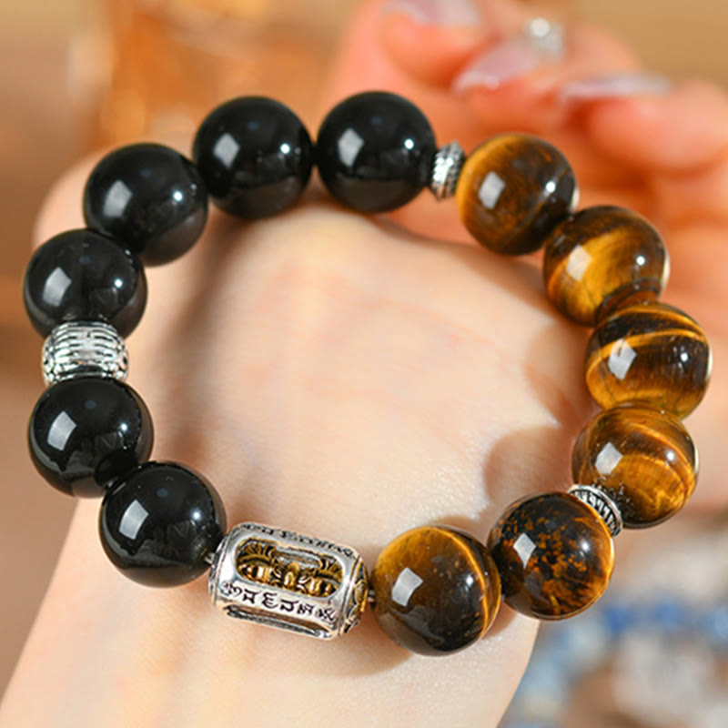 Bracciale di protezione Vajra in ossidiana naturale con occhio di tigre e argento lucido Buddha Stones