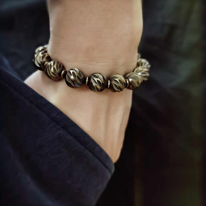 Braccialetto della ricchezza con perline di ottone e rame, motivo a coltello anticato , Buddha Stones