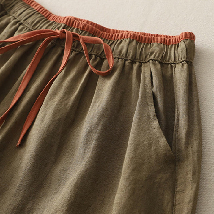Pantaloni da donna a gamba larga con coulisse e tasche, modello casual color block con motivo Buddha Stones. - image 1