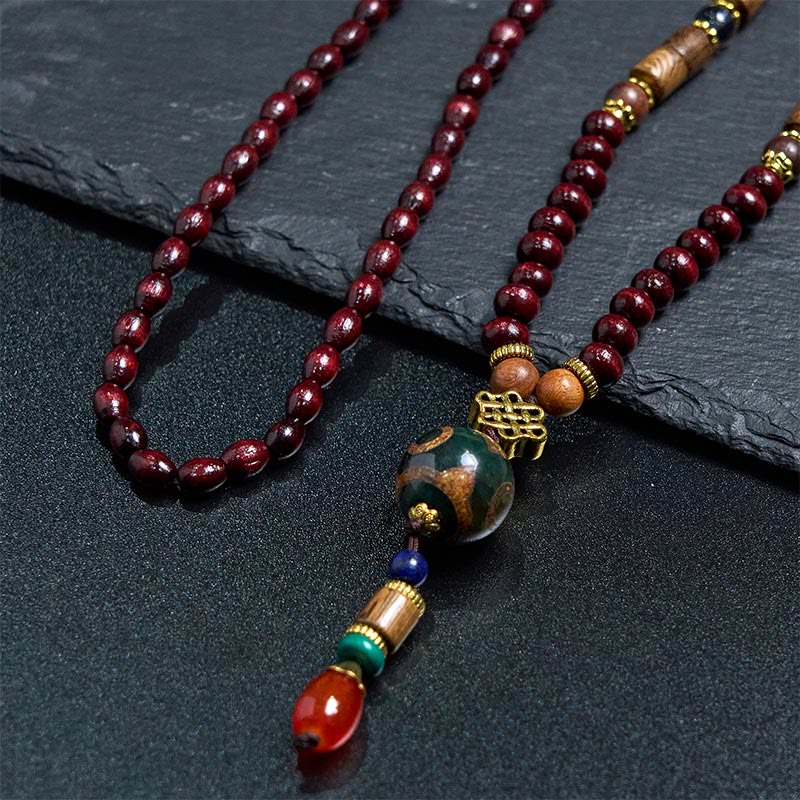 Collana con ciondolo a forma di testa di elefante, in legno wengé, fatto a mano in Tibet, con perline Dzi di protezione. - image 3