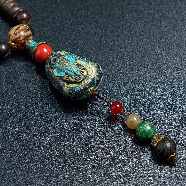 Collana con ciondolo a forma di testa di elefante, in legno wengé, fatto a mano in Tibet, con perline Dzi di protezione. - image 13