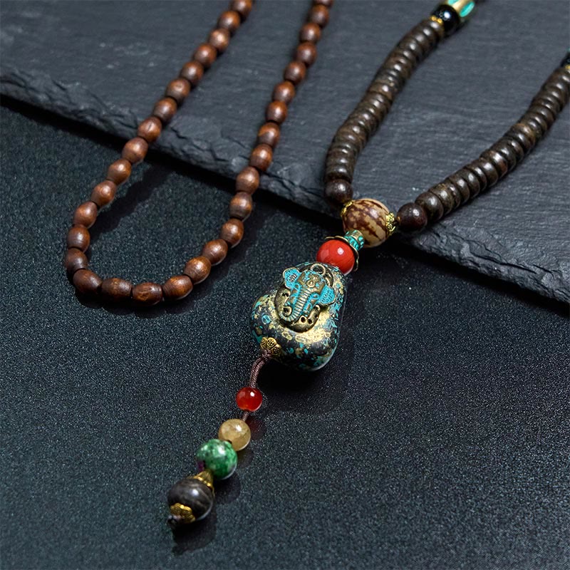 Collana con ciondolo a forma di testa di elefante, in legno wengé, fatto a mano in Tibet, con perline Dzi di protezione. - image 11