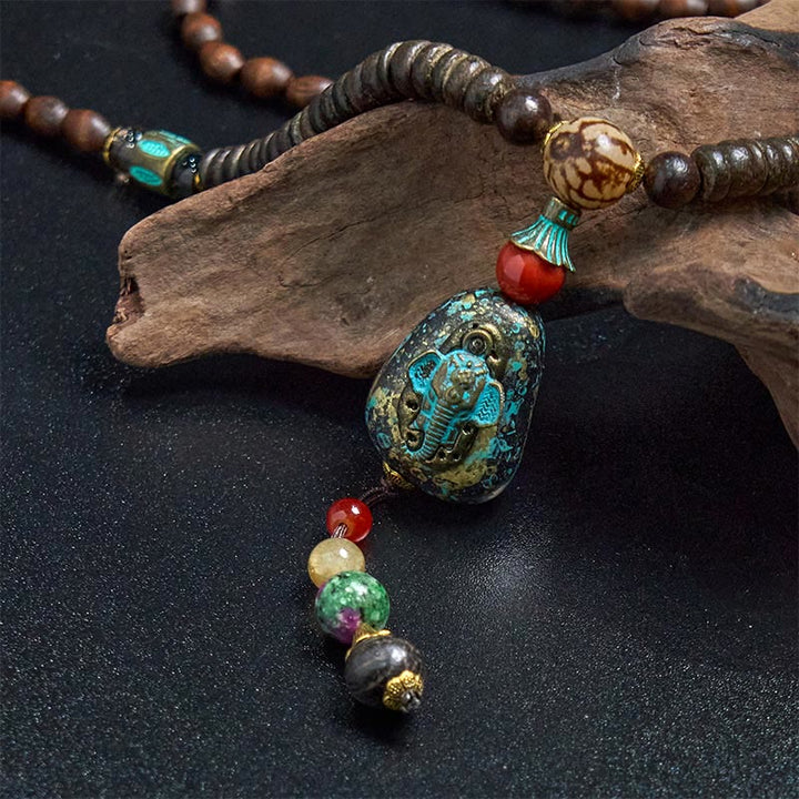 Collana con ciondolo a forma di testa di elefante, in legno wengé, fatto a mano in Tibet, con perline Dzi di protezione. - image 12
