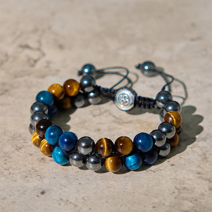 Braccialetto di forza con perline a doppia fila, motivo Om, in occhio di tigre blu naturale e magnetite nera con Buddha Stones