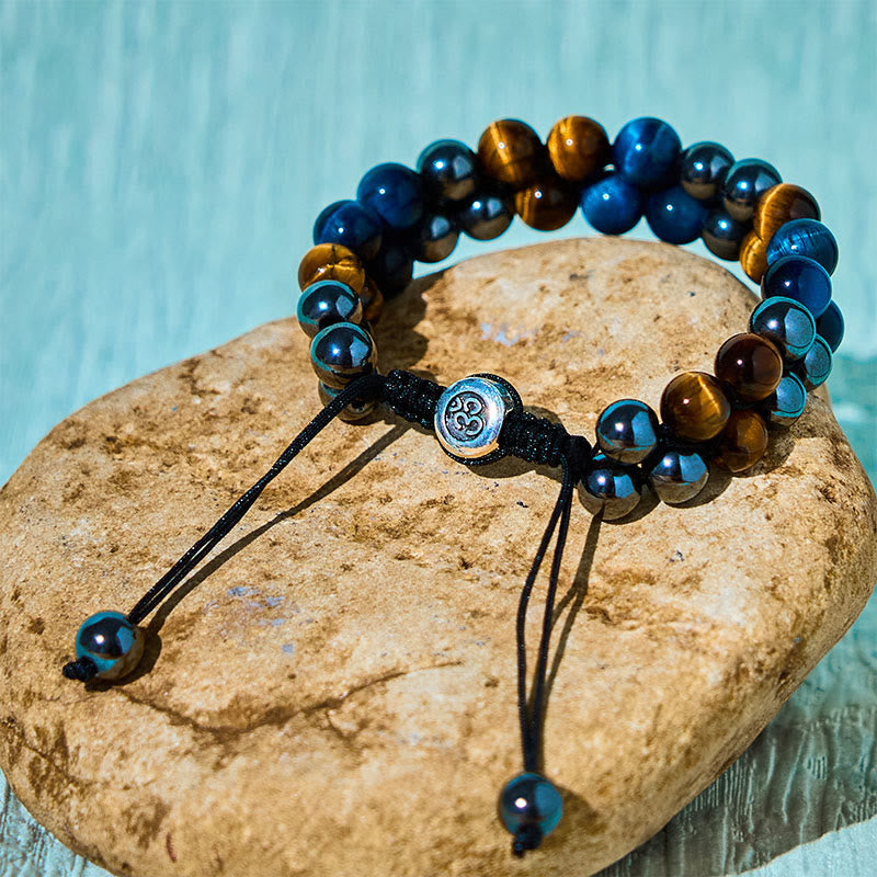 Braccialetto di forza con perline a doppia fila, motivo Om, in occhio di tigre blu naturale e magnetite nera con Buddha Stones