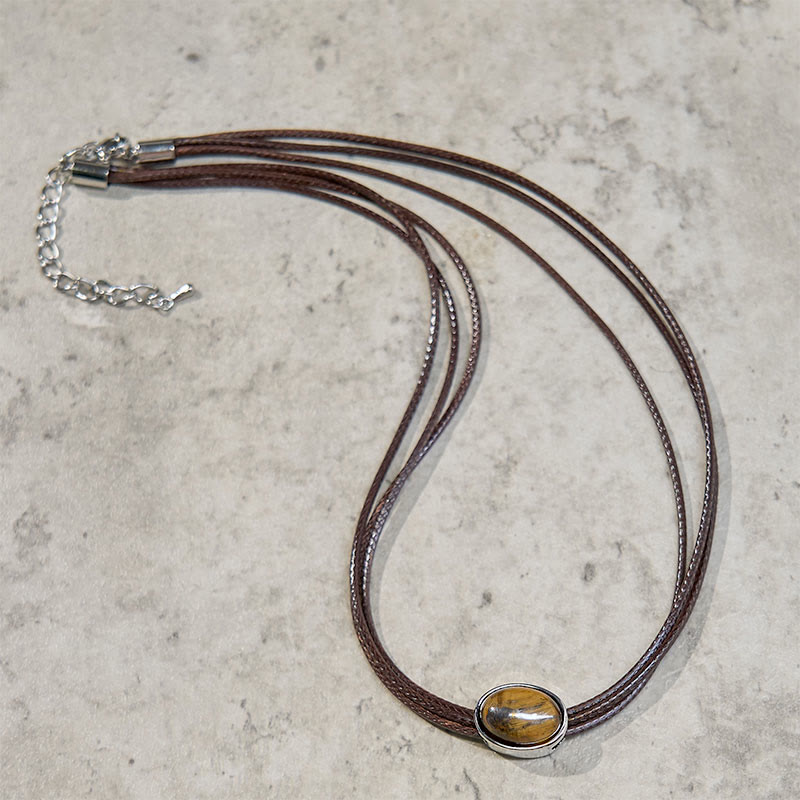 Collana con ciondolo in corda di cera con protezione ellittica in occhio di tigre naturale Buddha Stones