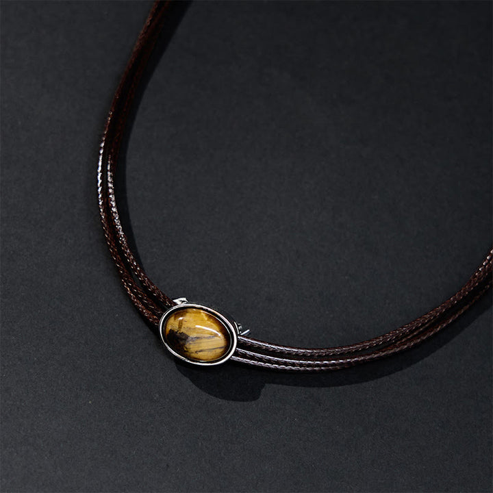 Collana con ciondolo in corda di cera con protezione ellittica in occhio di tigre naturale Buddha Stones