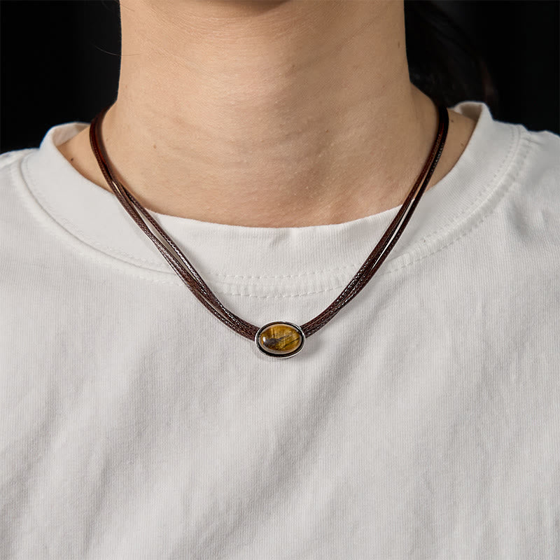 Collana con ciondolo in corda di cera con protezione ellittica in occhio di tigre naturale Buddha Stones