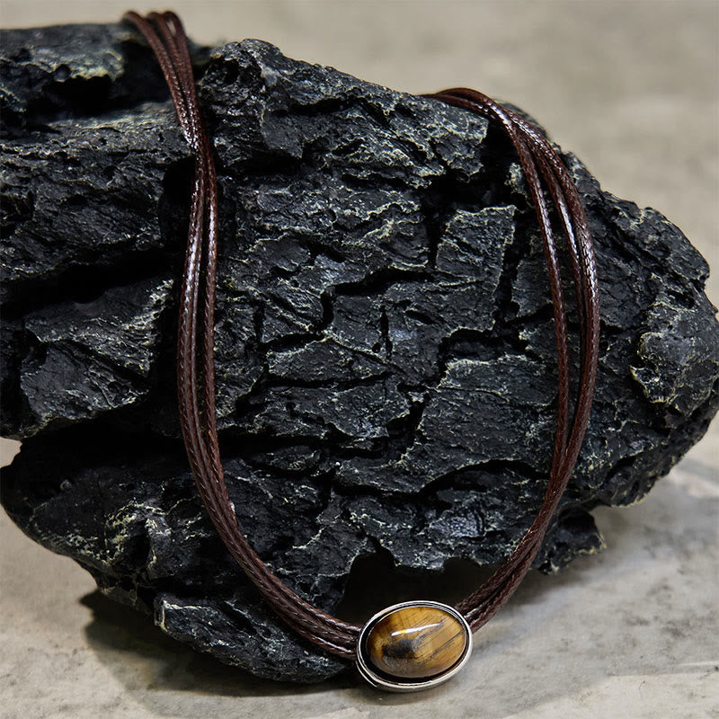 Collana con ciondolo in corda di cera con protezione ellittica in occhio di tigre naturale Buddha Stones