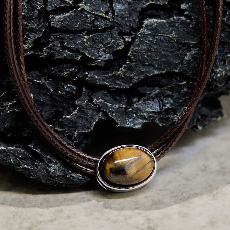 Collana con ciondolo in corda di cera con protezione ellittica in occhio di tigre naturale Buddha Stones