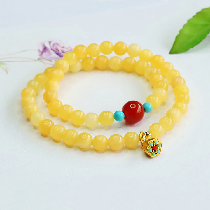 Bracciale della fortuna con perline di agata rossa e topazio Buddha Stones