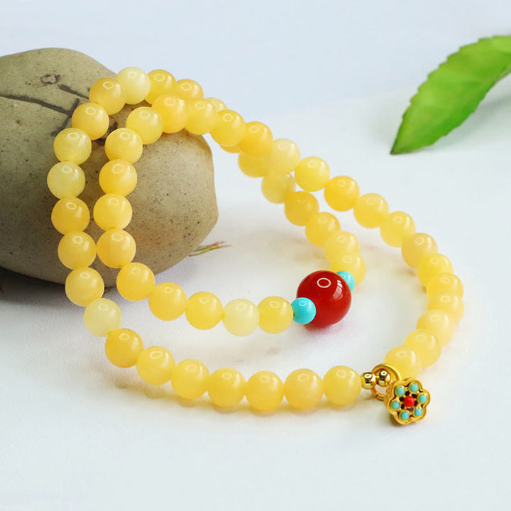 Bracciale della fortuna con perline di agata rossa e topazio Buddha Stones