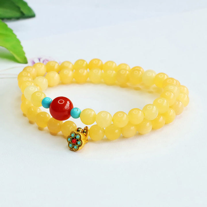 Bracciale della fortuna con perline di agata rossa e topazio Buddha Stones