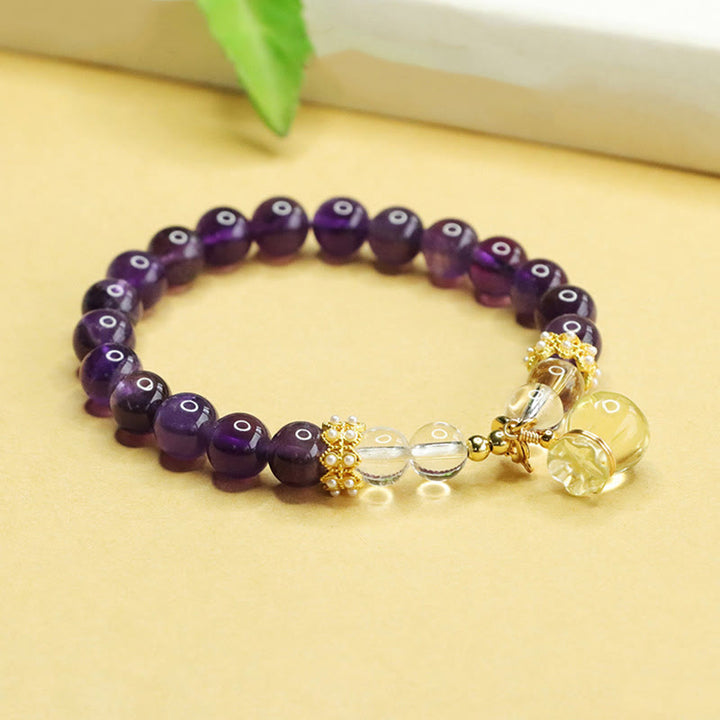 Bracciale Buddha Stones con ciondolo a forma di borsa porta soldi in ametista e citrino naturale