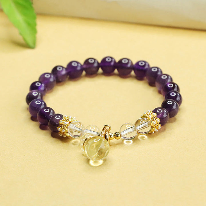 Bracciale Buddha Stones con ciondolo a forma di borsa porta soldi in ametista e citrino naturale