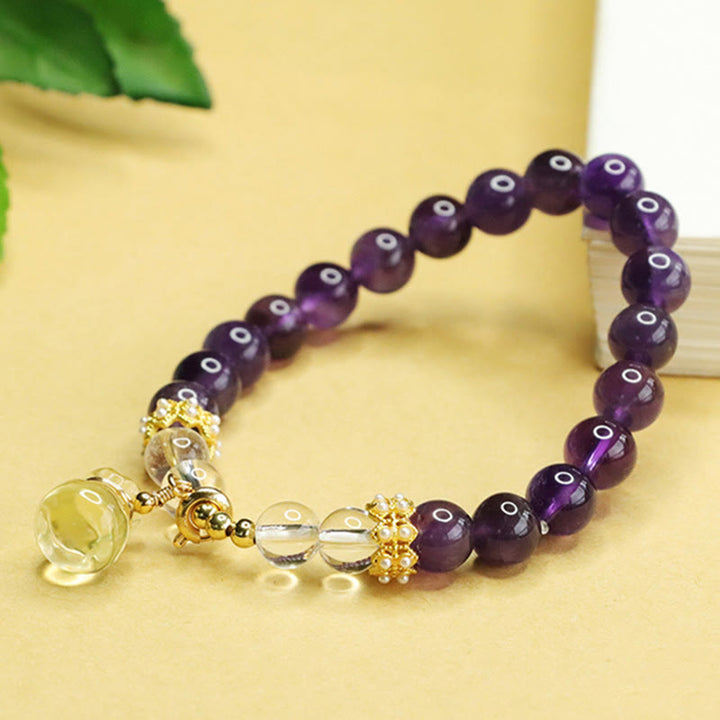 Bracciale Buddha Stones con ciondolo a forma di borsa porta soldi in ametista e citrino naturale