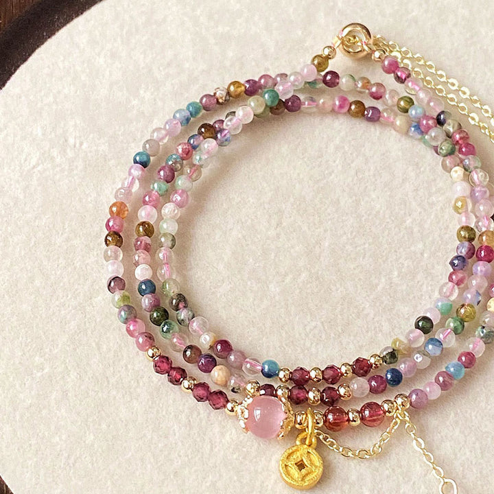 Bracciale della saggezza con moneta di tormalina colorata e perline irregolari da 2,5 mm Buddha Stones