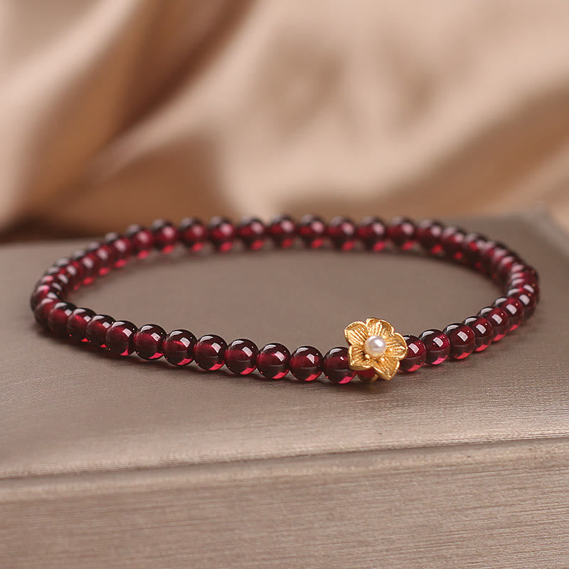 Bracciale Buddha Stones con perle di granato naturale da 4 mm e fiore della passione