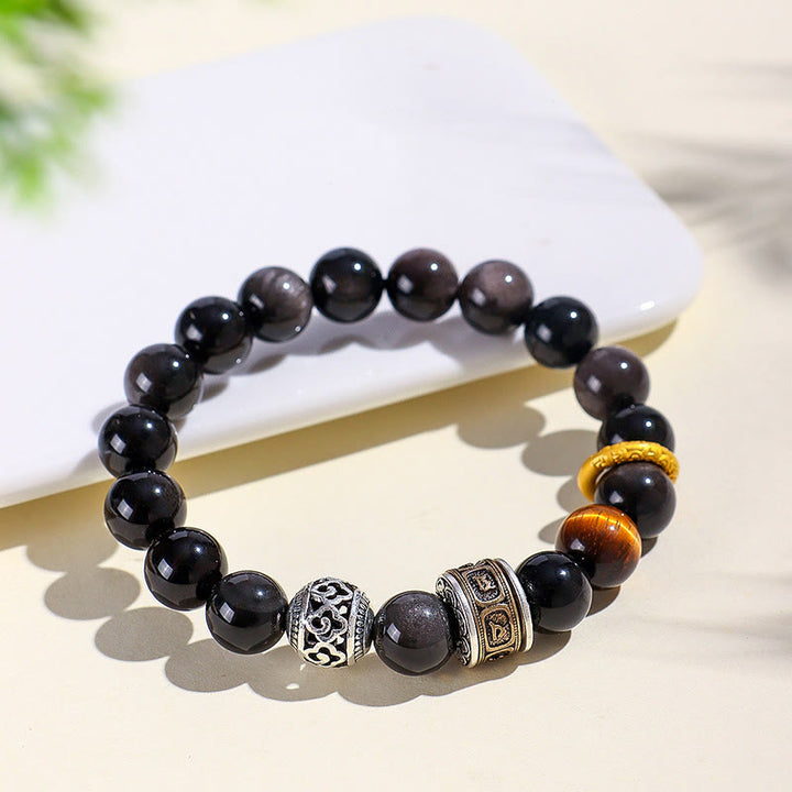 Bracciale di protezione Om Mani Padme Hum in ossidiana lucida color argento Buddha Stones