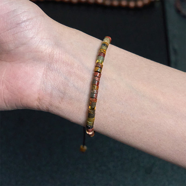 Bracciale con perline distanziatrici in rodonite e Buddha Stones per la guarigione delle relazioni