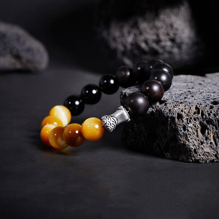Bracciale relax Buddha Stones in argento sterling 999, ebano, occhio di tigre, ossidiana nera - image 1
