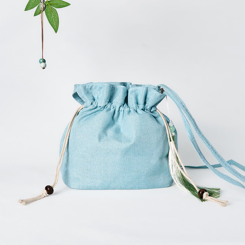 Borsa a tracolla in lino e cotone di bambù verde ricamata con Buddha Stones