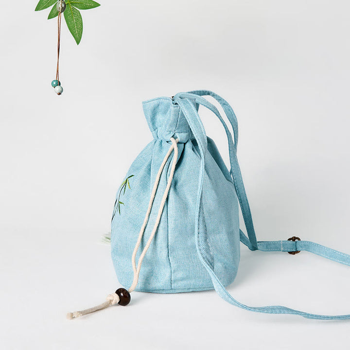 Borsa a tracolla in lino e cotone di bambù verde ricamata con Buddha Stones