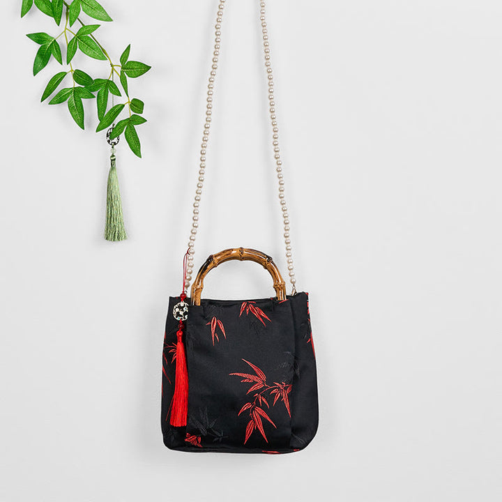 Borsa a tracolla con tracolla in perle, manico in bambù, in poliestere e cotone ricamato con Buddha Stones