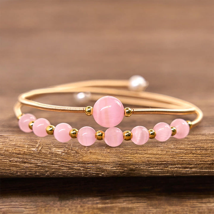 Bracciale rigido in metallo con supporto per occhio di gatto rosa in rame riempito d'oro 14K Buddha Stones