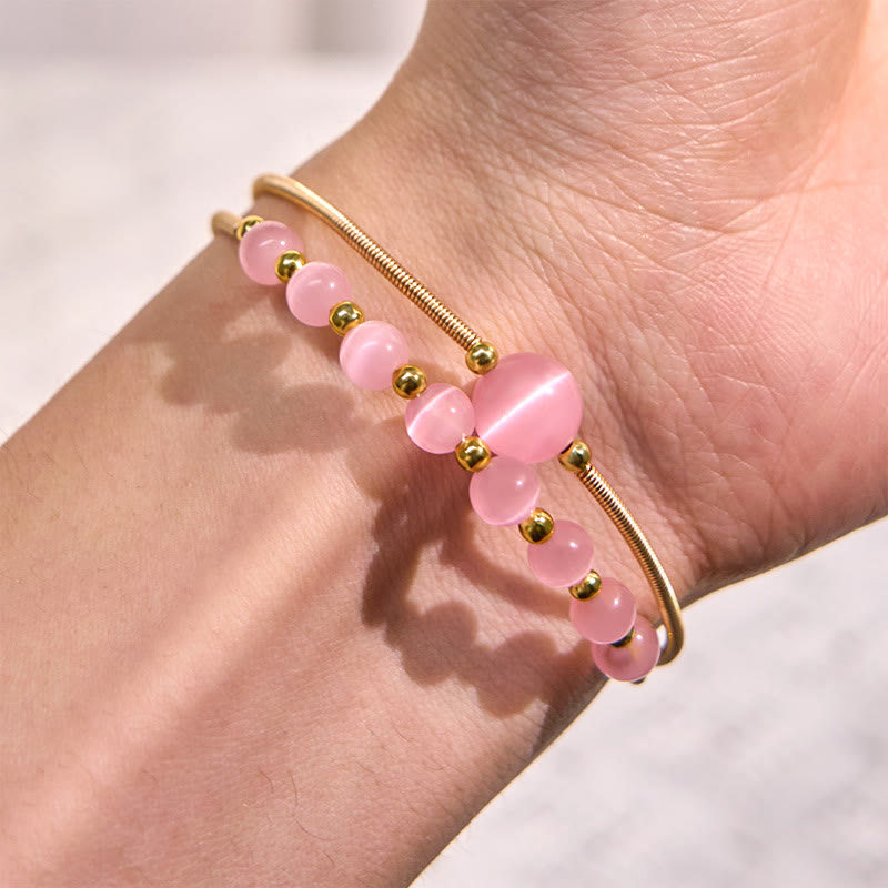Bracciale rigido in metallo con supporto per occhio di gatto rosa in rame riempito d'oro 14K Buddha Stones