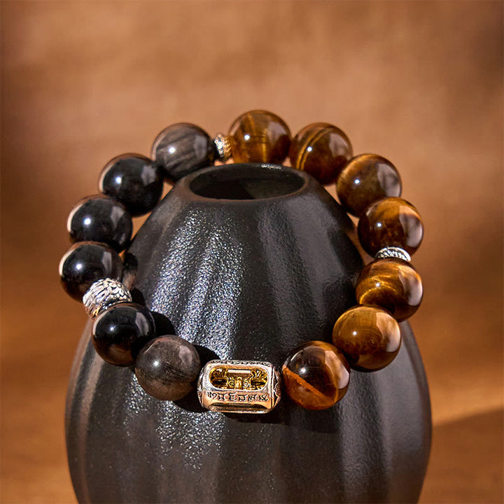 Bracciale di protezione Vajra in ossidiana naturale con occhio di tigre e argento lucido Buddha Stones