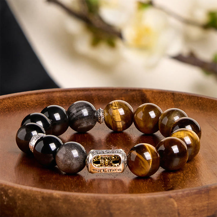 Bracciale di protezione Vajra in ossidiana naturale con occhio di tigre e argento lucido Buddha Stones