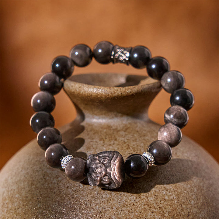 Bracciale di protezione della danza del leone in ossidiana lucida e argento naturale Buddha Stones