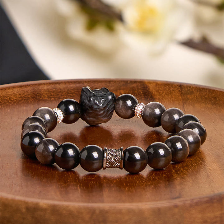 Bracciale di protezione della danza del leone in ossidiana lucida e argento naturale Buddha Stones