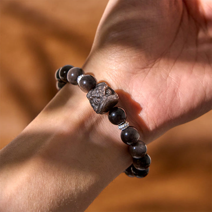 Bracciale di protezione della danza del leone in ossidiana lucida e argento naturale Buddha Stones