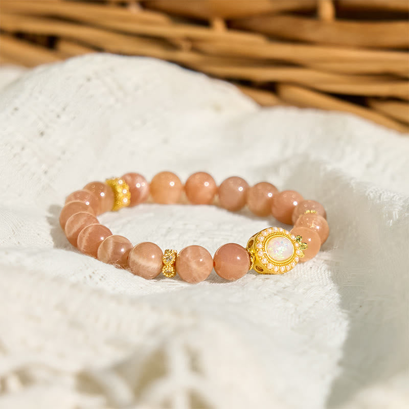 Braccialetto regolabile e rilassante Buddha Stones in pietra di luna naturale color pesca