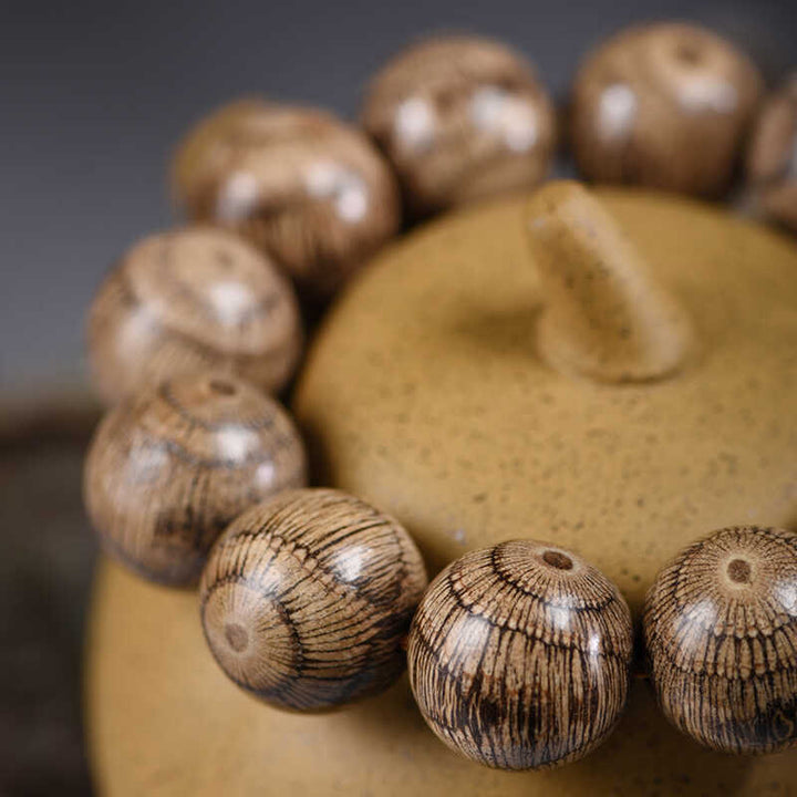 Braccialetto di protezione con perline di legno di gnetum Buddha Stones - image 10