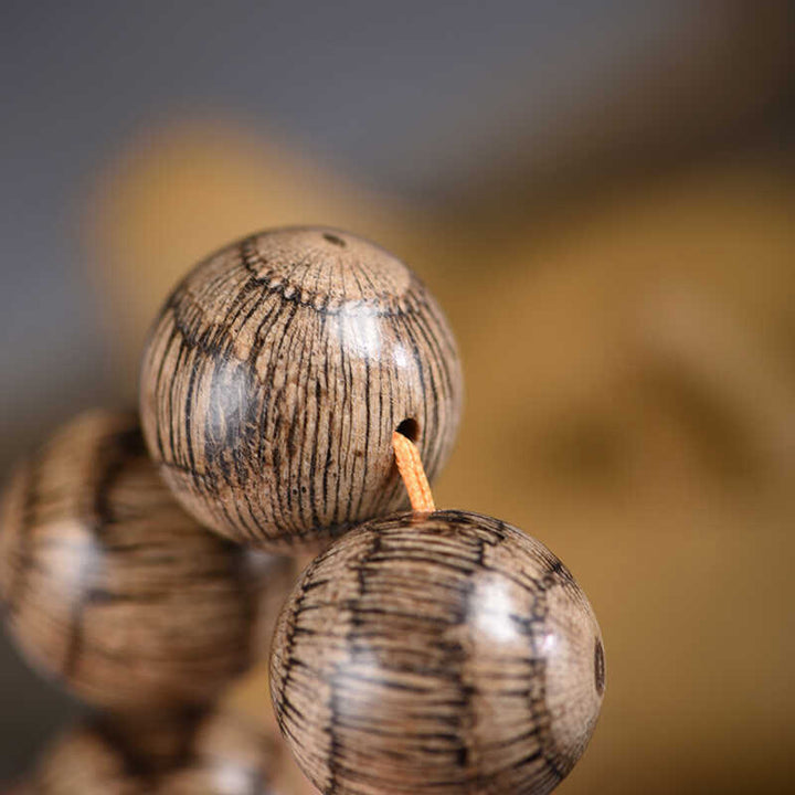 Braccialetto di protezione con perline di legno di gnetum Buddha Stones - image 11