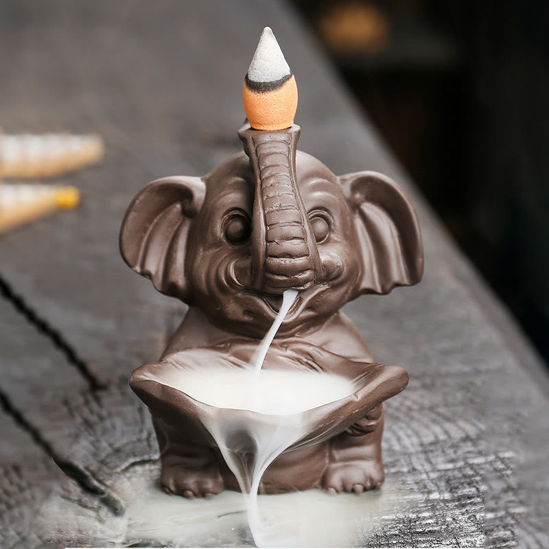 Buddha Stones, piccolo elefante che tiene una foglia, argilla viola, fontana di fumo a riflusso, bruciatore di incenso curativo, decorazione - 7,4*7,9*10,5 cm - image 0